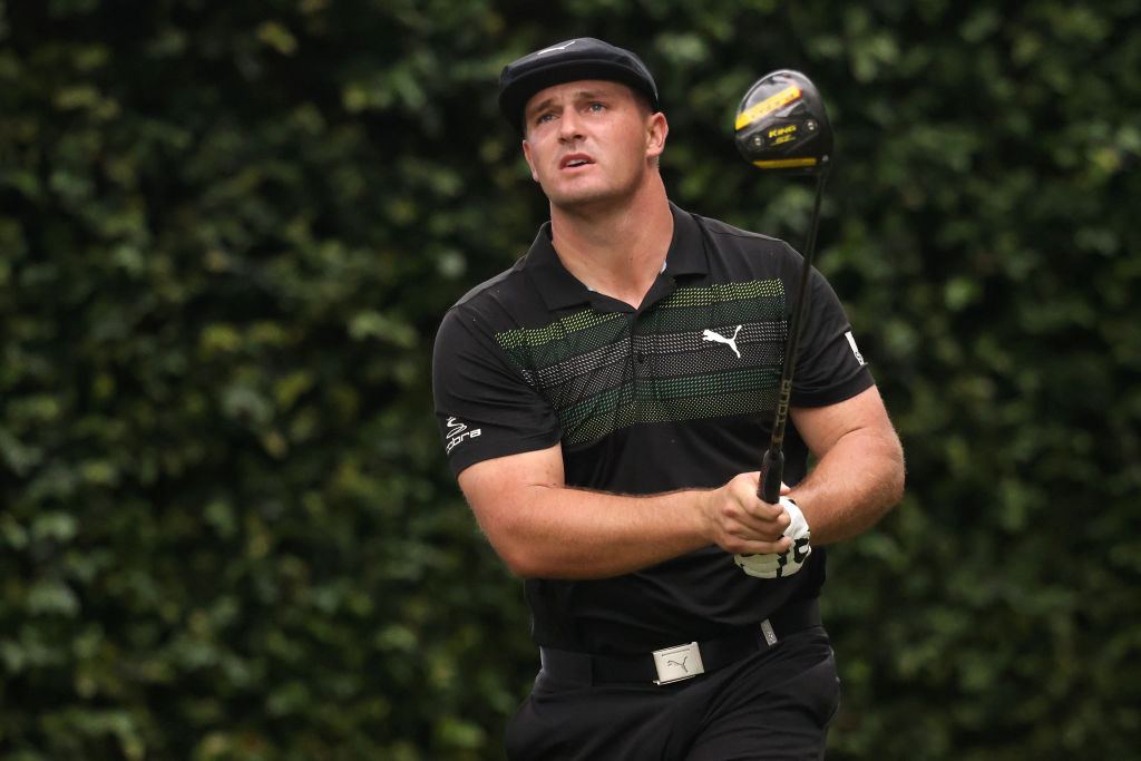 Bryson DeChambeau swings his golf club.