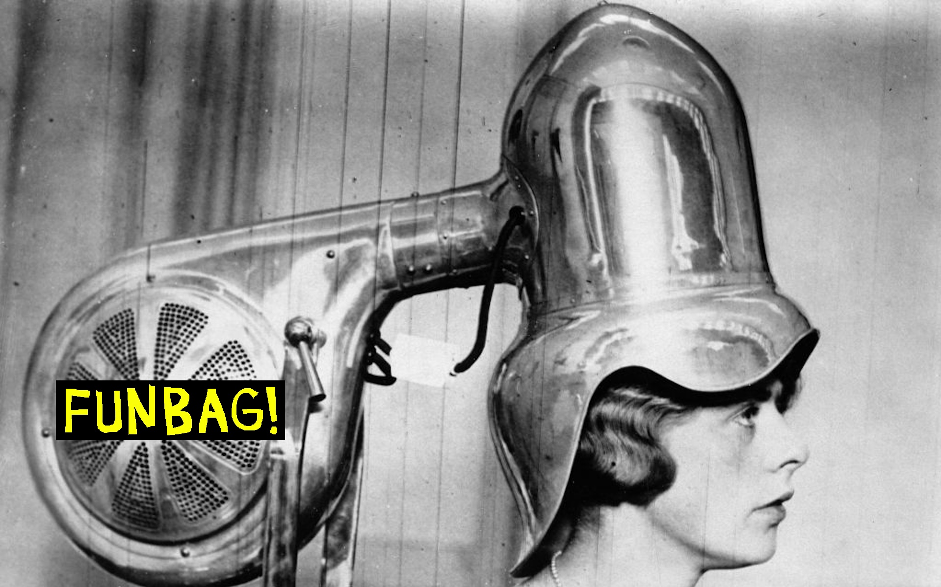 A new type of dryer is presented on the hair fashion show in London. About 1935. Photograph.