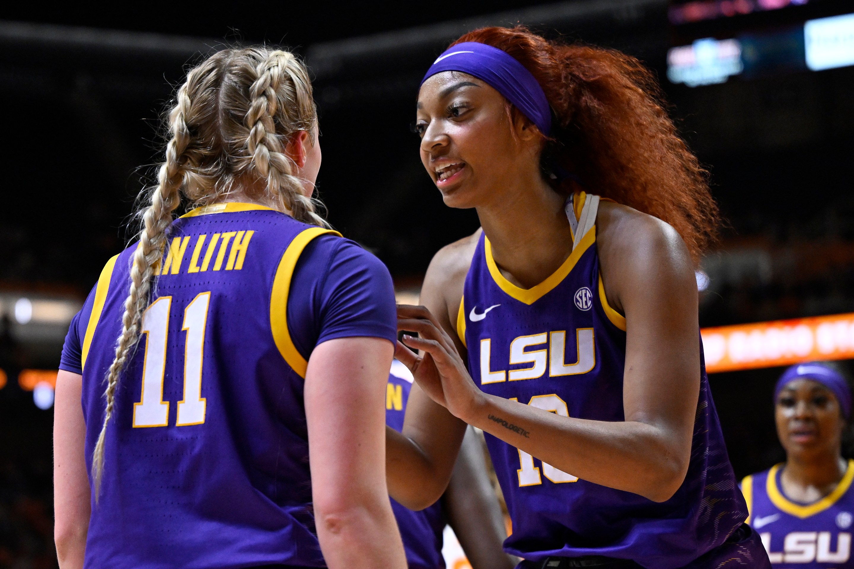 Hailey Van Lith #11 and Angel Reese #10 of the LSU Lady Tigers speak against the Tennessee Lady Vols in the second quarter at Thompson-Boling Arena on February 25, 2024 in Knoxville, Tennessee.