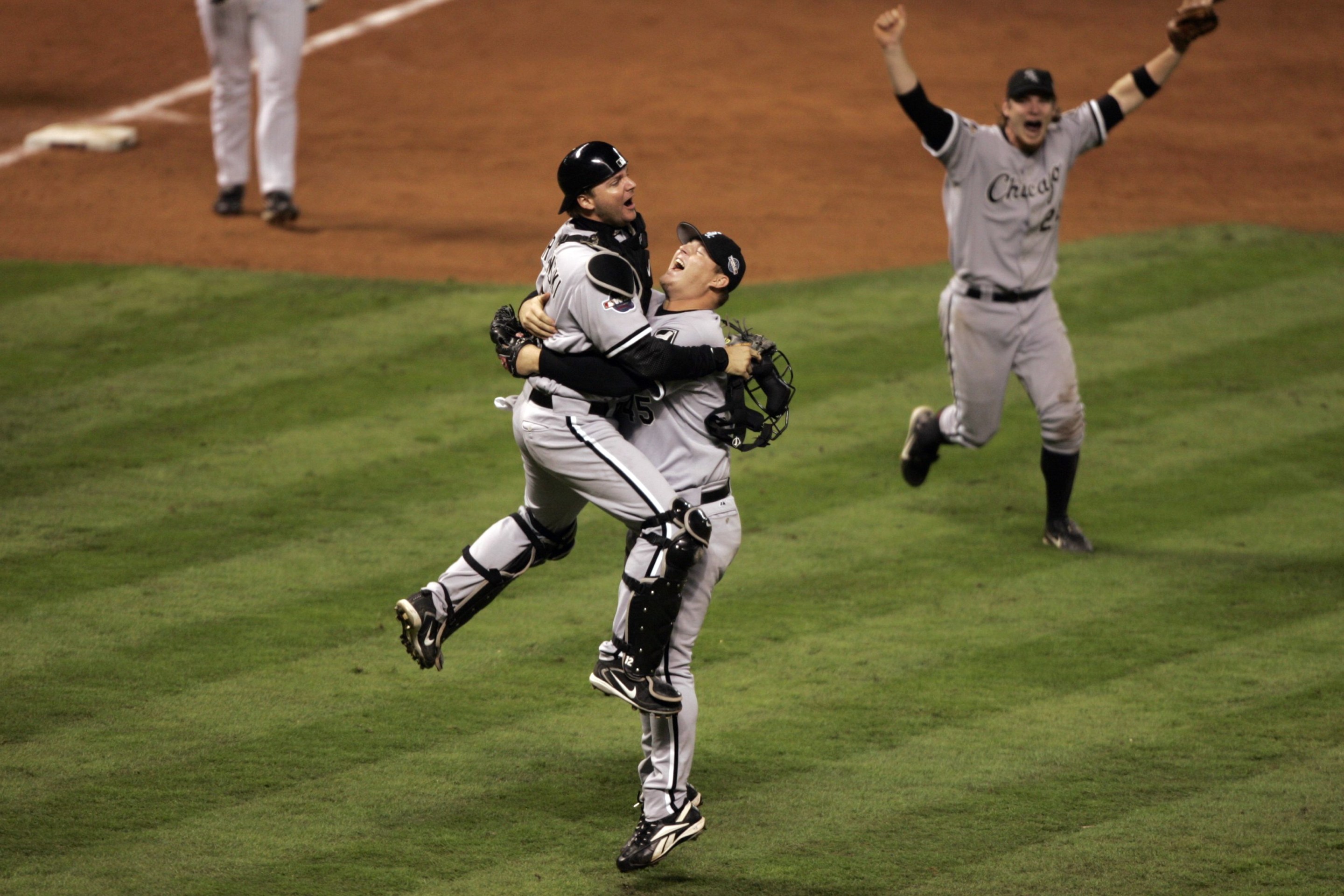 UNITED STATES - OCTOBER 26: Baseball: World Series, Chicago White Sox A,J, Pierzynski (12) and Bobby Jenks (45) victorious after winning Game 4 and series vs Houston Astros, Houston, TX 10/26/2005 (Photo by John Biever/Sports Illustrated via Getty Images) (SetNumber: X74496 TK4)